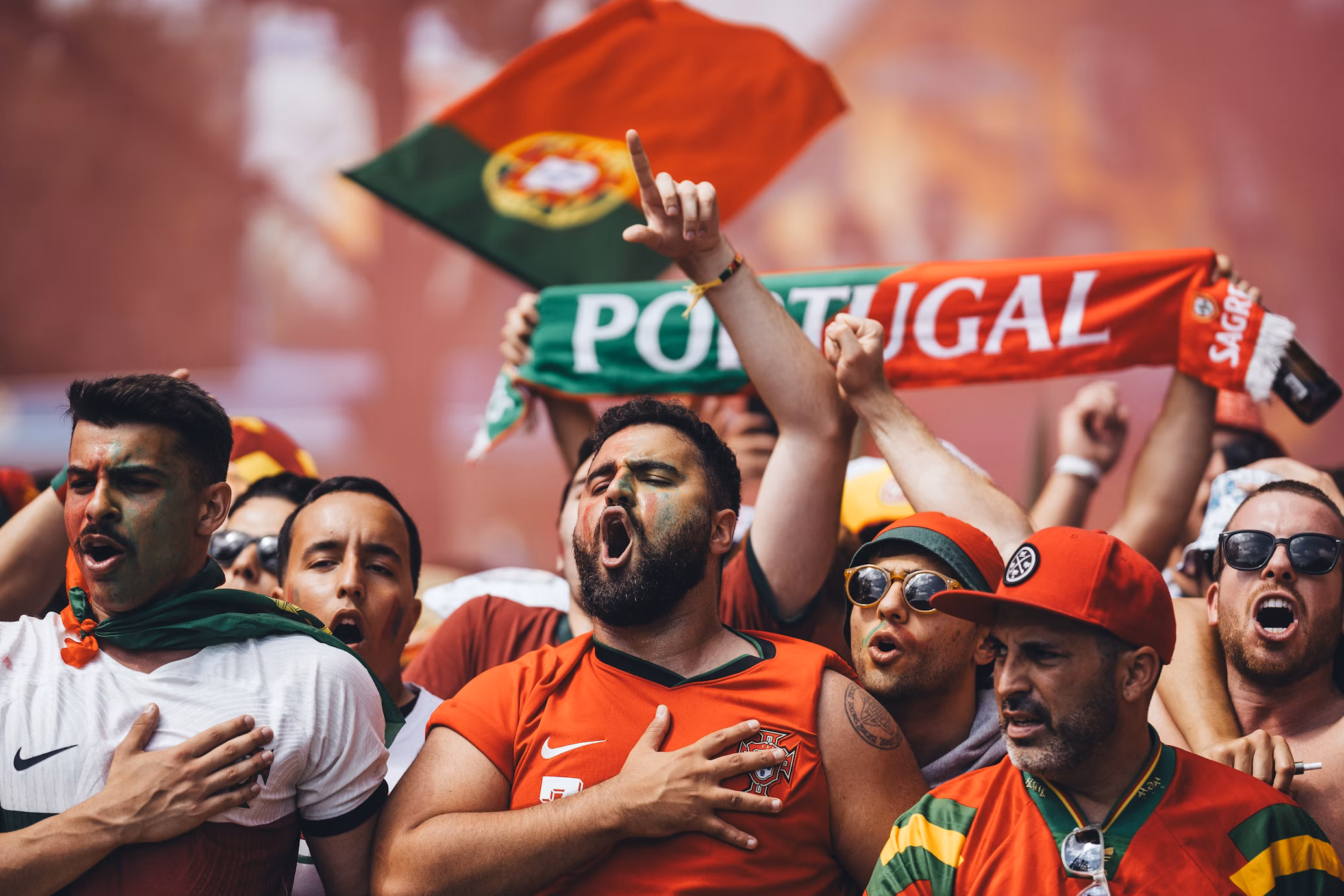 people in green and red clothes singing
